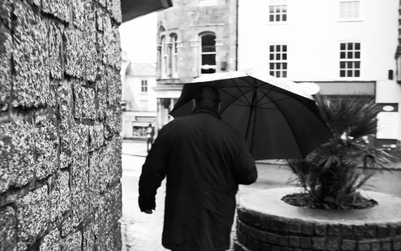 A man with an umbrella.