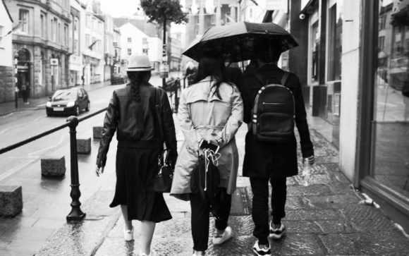 Three tourists in the rain.