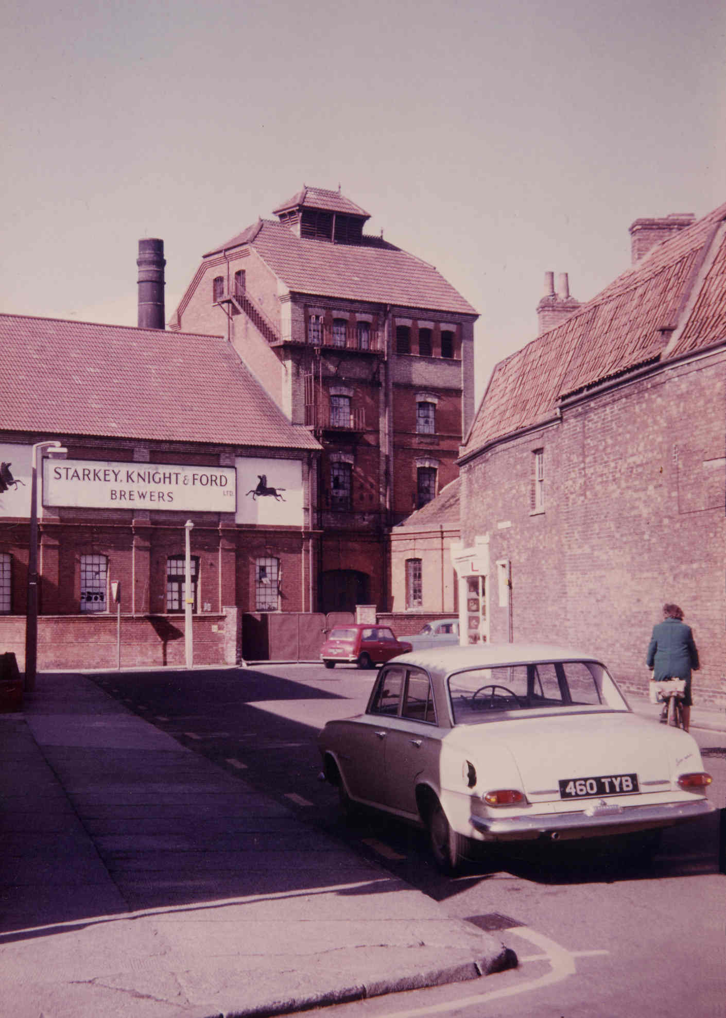 Brewery buildings with a vintage car.