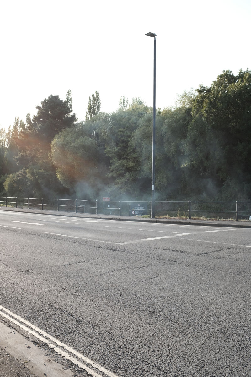 Fumes on a quiet street.