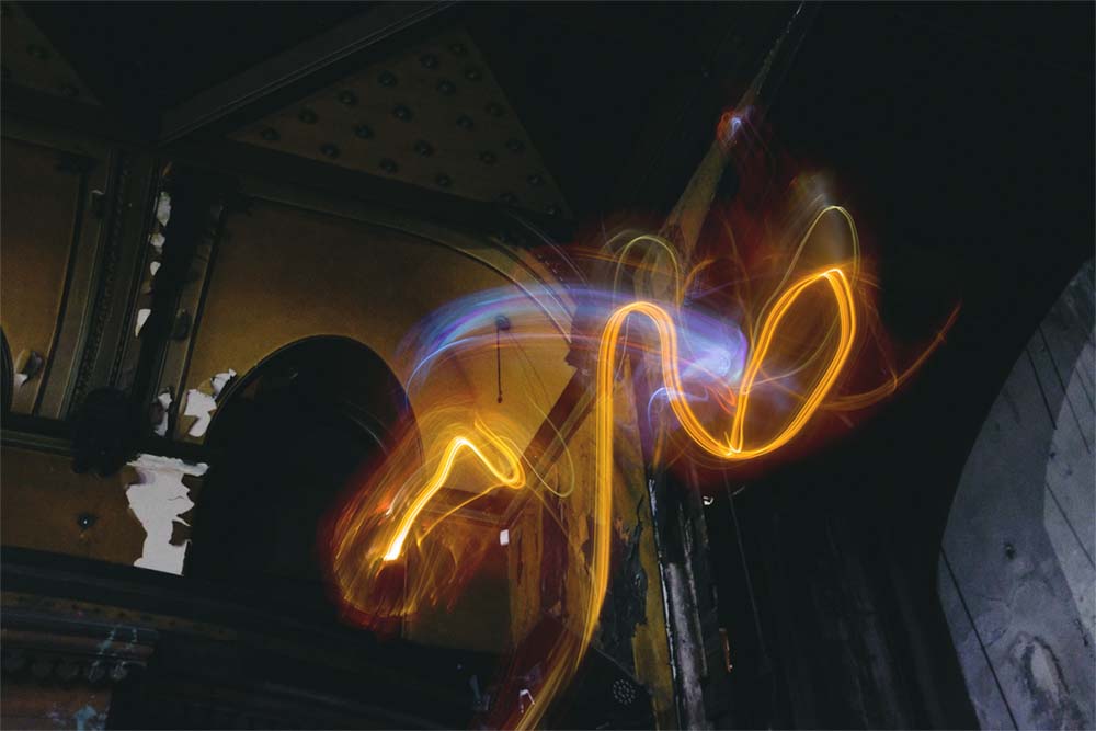A swirl of light in an abandoned music hall.