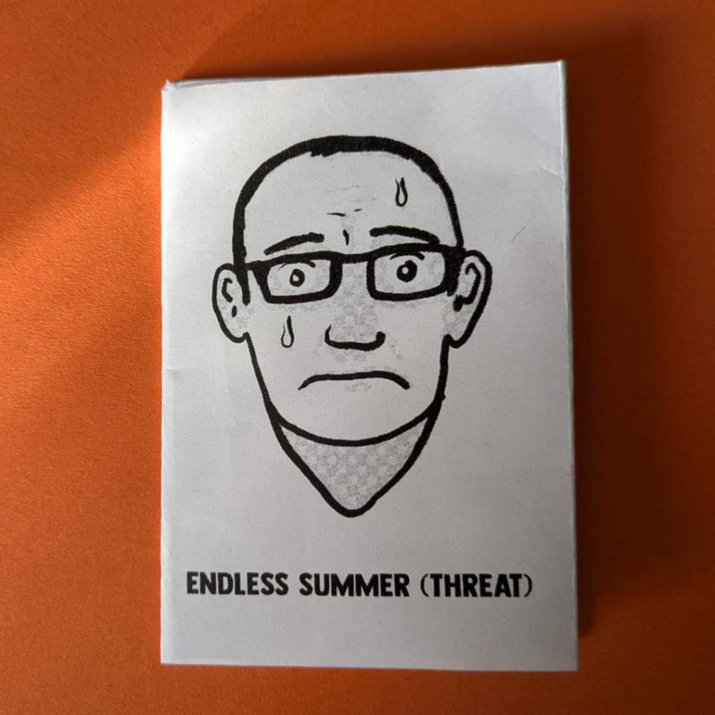 A small zine printed on a folded sheet of A4. The cover image is a self portrait of me (bald, glasses) sweating and looking miserable.